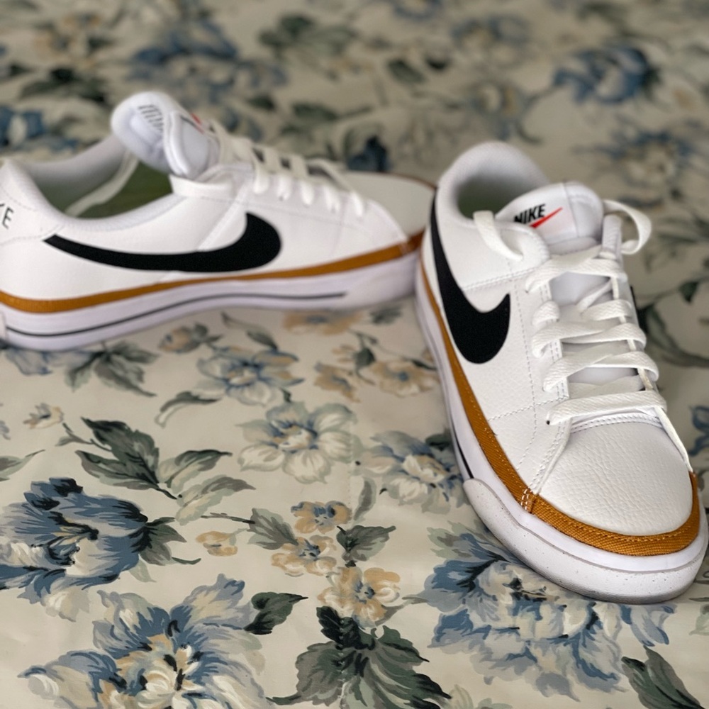 Nike White Sneakers with Gold and Black Accents
